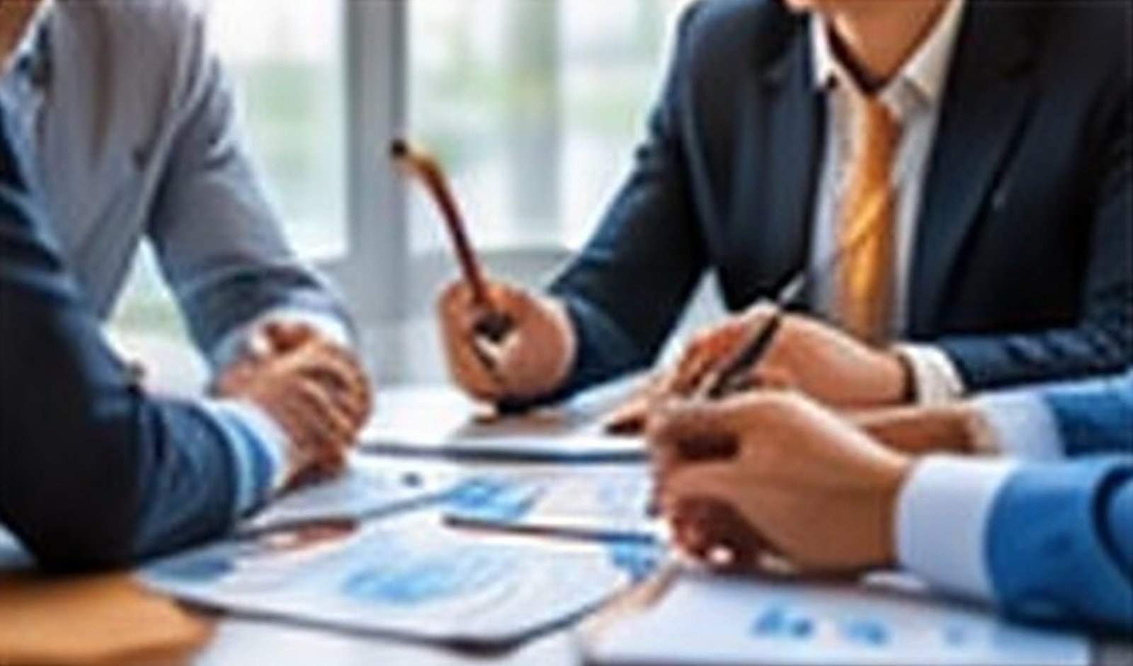 Business meeting over trade documents